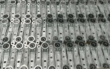 Mass production linkages for snowsweeper